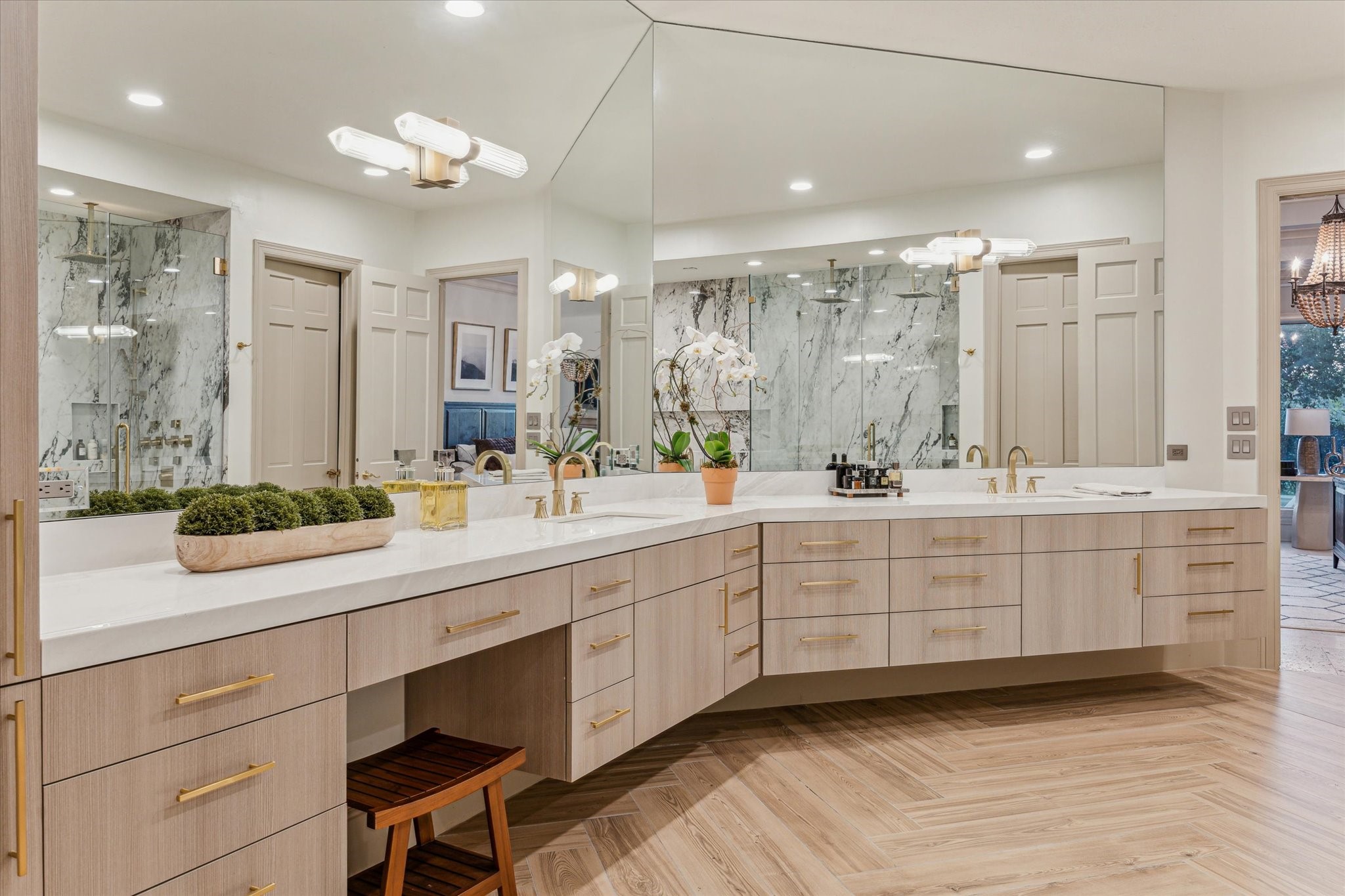 918 Huntington Cove Houston, TX 77063 - Photo 40 of 50 Another perspective reveals the stunning details of the extravagant bathroom highlighting the mirrored walls, dual vanities and makeup station.