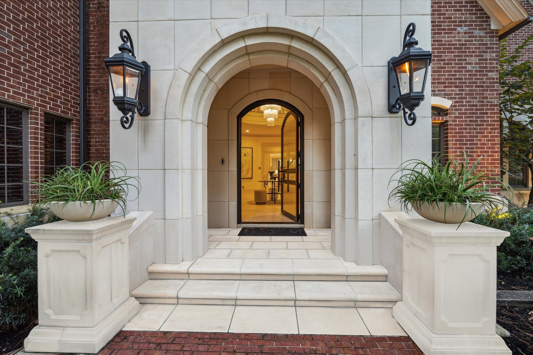 918 Huntington Cove Houston, TX 77063 - Photo 4 of 50 The entrance viewed up close, reveals the intricate, beautiful architectural design, and the impressive iron and glass entryway front door adding a touch of elegance .