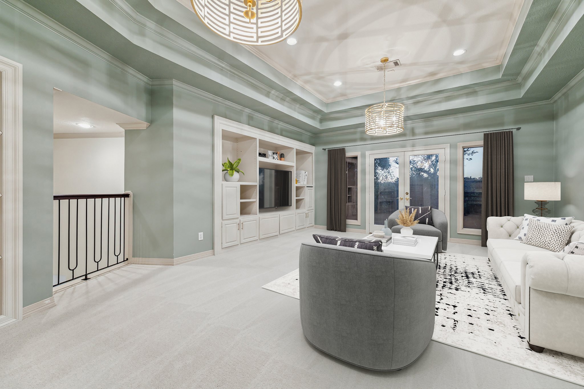 918 Huntington Cove Houston, TX 77063 - Photo 47 of 50 Ascend to the second floor media or game room, complete with custom designed TV built-ins, tray ceiling, two hanging chandeliers and French doors lead to a balcony. offering a commanding view of the pool and back yard oasis. Photo is virtually staged