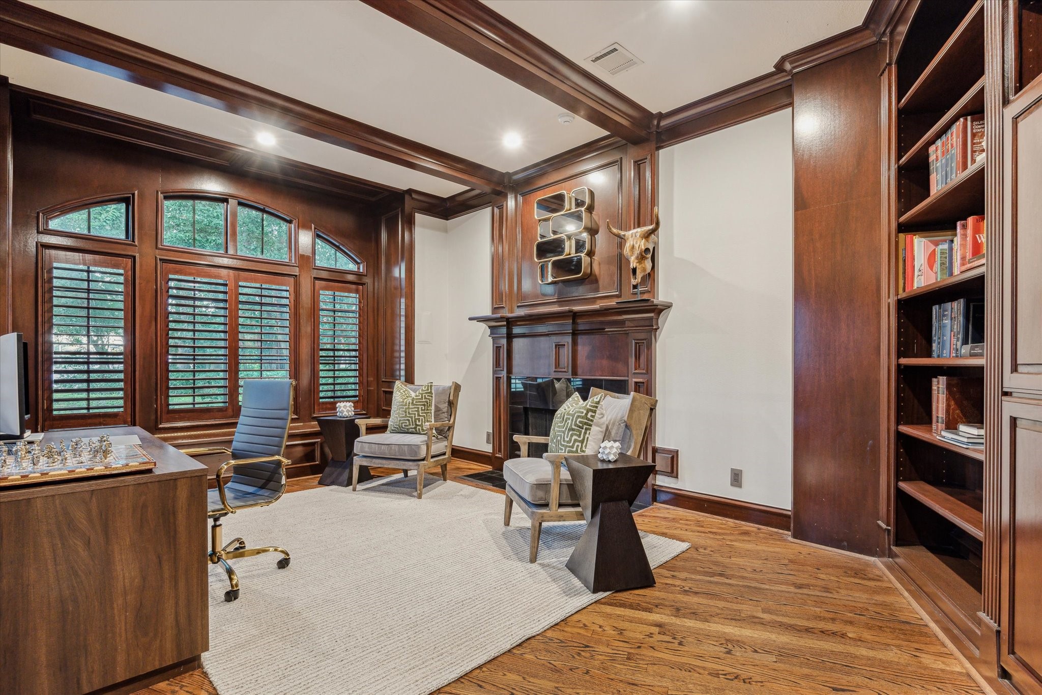 918 Huntington Cove Houston, TX 77063 - Photo 7 of 50 A closer look at the library/home office architectural details, featuring exposed ceiling beams and classic plantation shutters.