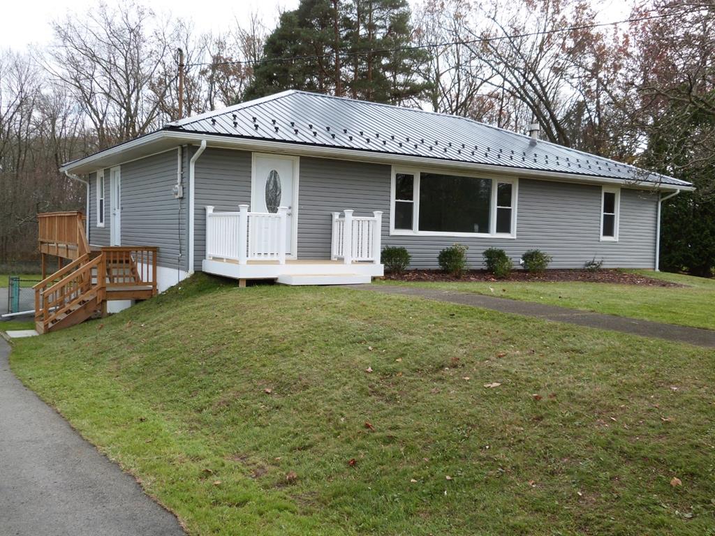 1463 Pittsburgh Road Franklin, PA 16323 - Photo 1 of 32 a view of a house with a yard