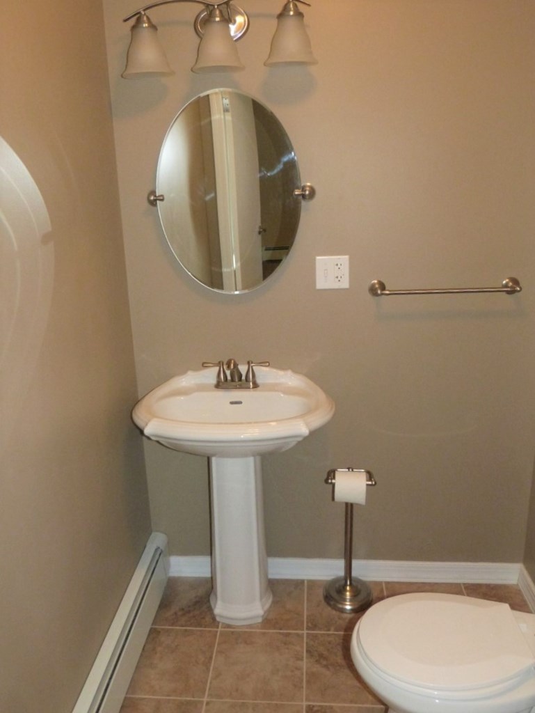1463 Pittsburgh Road Franklin, PA 16323 - Photo 17 of 32 a bathroom with a sink toilet and a mirror