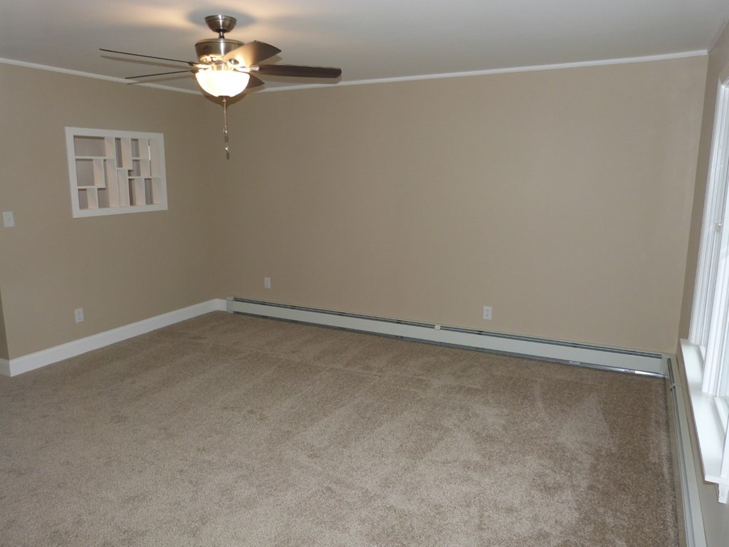 1463 Pittsburgh Road Franklin, PA 16323 - Photo 21 of 32 an empty room with a chandelier fan
