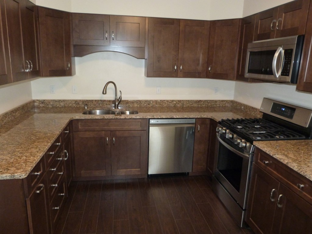 1463 Pittsburgh Road Franklin, PA 16323 - Photo 4 of 32 a kitchen with granite countertop a sink stove and cabinets