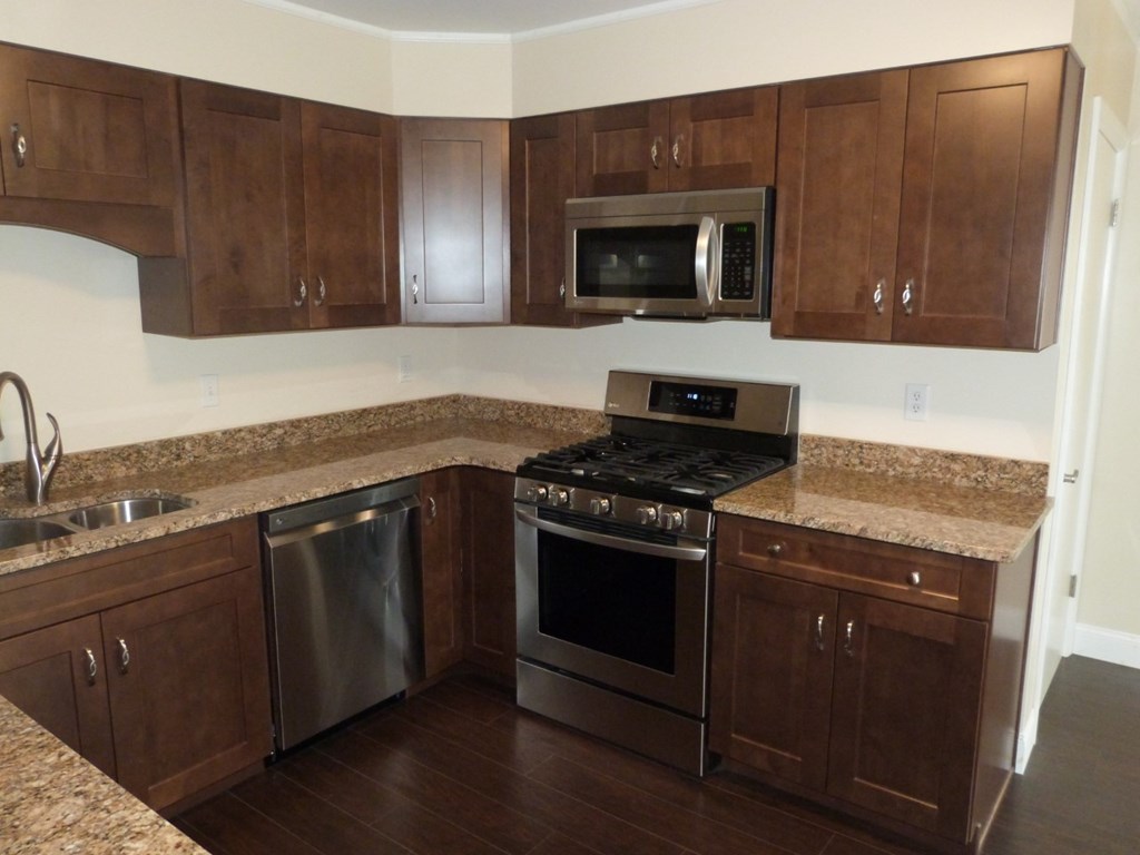 1463 Pittsburgh Road Franklin, PA 16323 - Photo 6 of 32 a kitchen with granite countertop wooden cabinets and stainless steel appliances