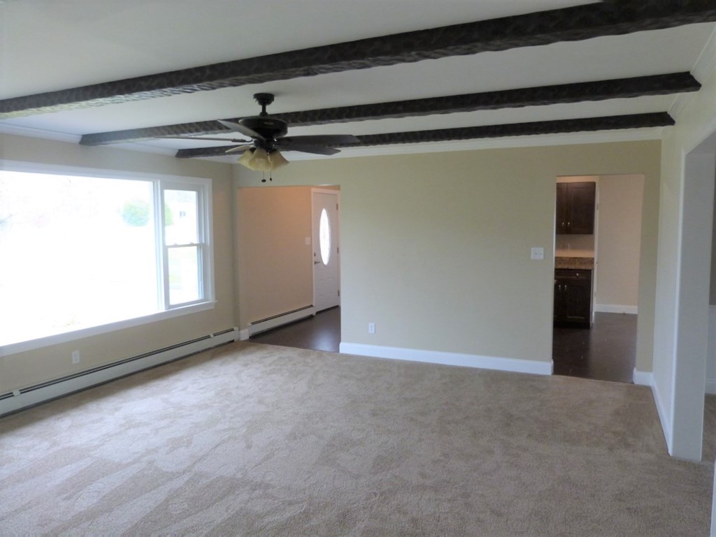 1463 Pittsburgh Road Franklin, PA 16323 - Photo 7 of 32 a view of a livingroom with a ceiling fan and window
