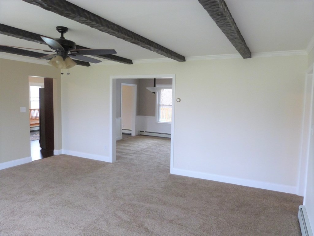 1463 Pittsburgh Road Franklin, PA 16323 - Photo 8 of 32 a view of a big room with wooden floor and windows
