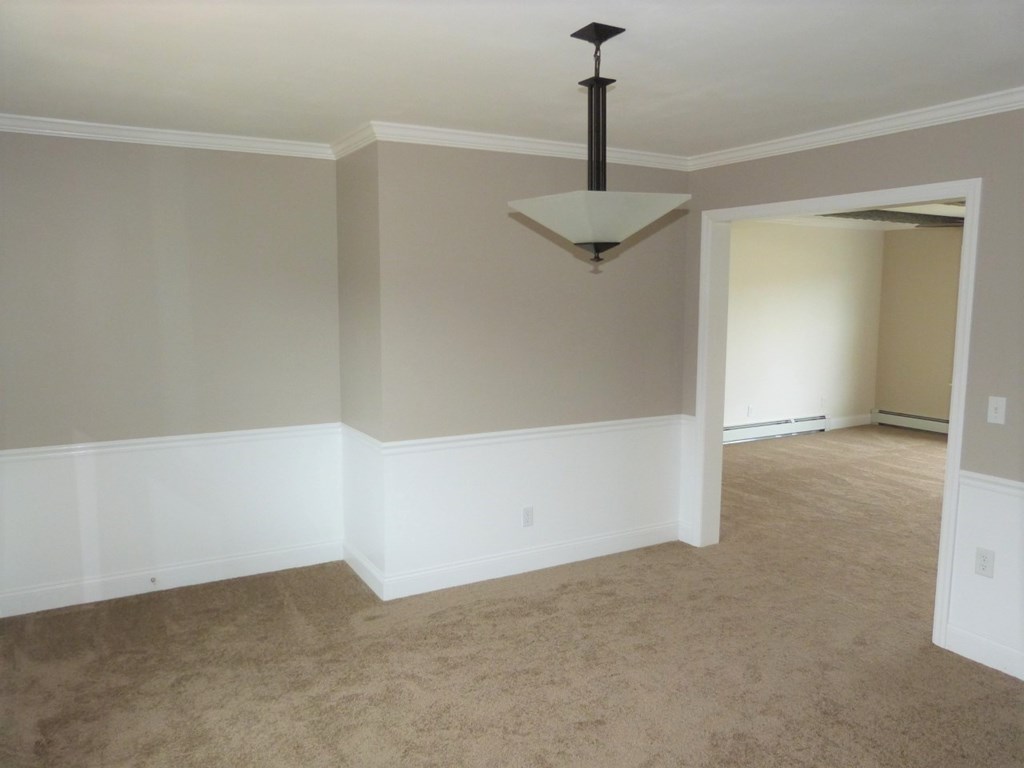 1463 Pittsburgh Road Franklin, PA 16323 - Photo 10 of 32 a view of an empty room with a chandelier