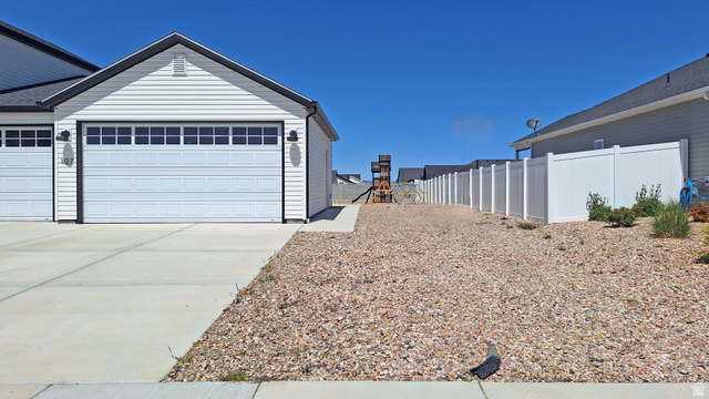 1127 4240 North Enoch, UT 84721 - Photo 3 of 56 Garage with driveway