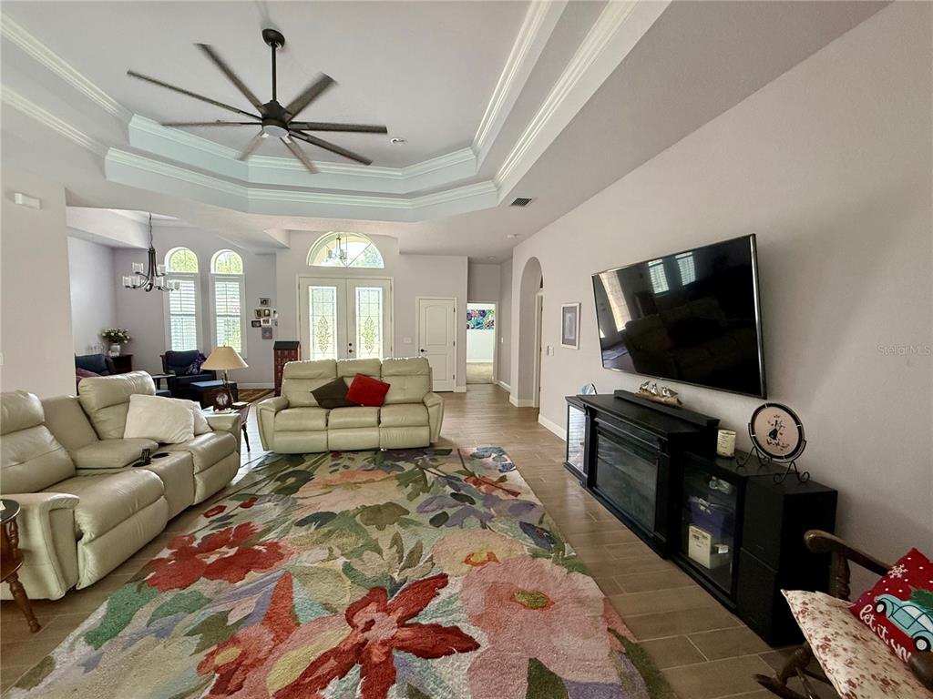 13110 Bamboo Street Spring Hill, FL 34609 - Photo 6 of 56 a living room with furniture and a flat screen tv