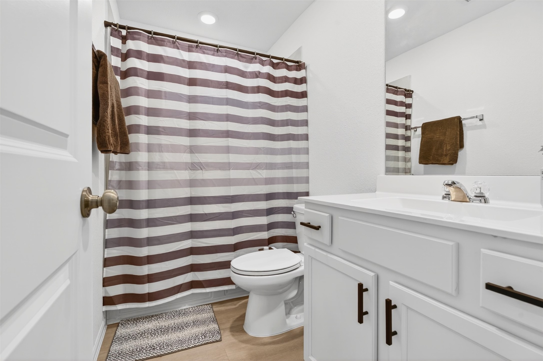 2832 Mistygate Court Conroe, TX 77301 - Photo 29 of 50 Secondary bathroom with vanity, tub-shower combo, and neutral finishes.