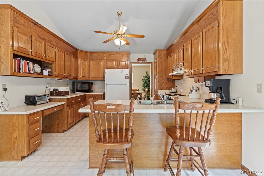3963 Doe Run Road Hopewell, VA 23860 - Photo 11 of 48 a kitchen with stainless steel appliances granite countertop a stove top oven a refrigerator a sink dishwasher and white cabinets with wooden floor