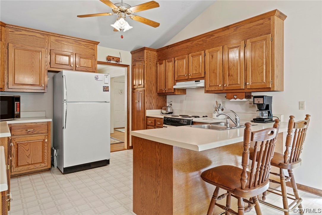 3963 Doe Run Road Hopewell, VA 23860 - Photo 12 of 48 a kitchen with a refrigerator a stove a sink dishwasher and a refrigerator