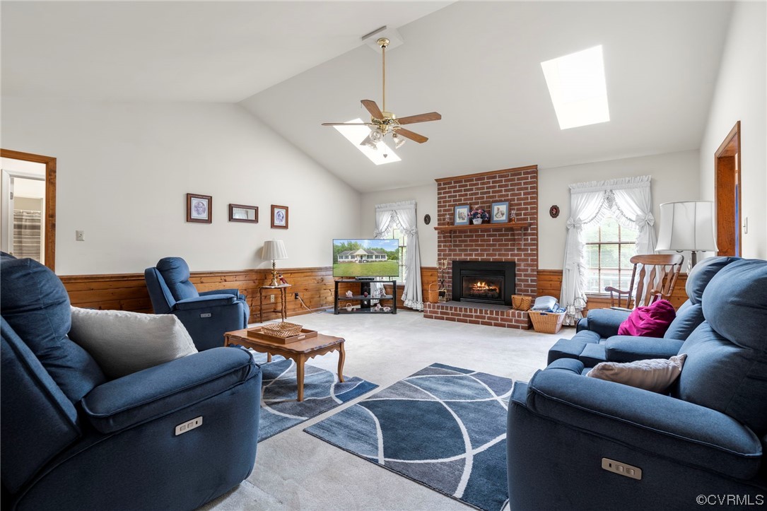3963 Doe Run Road Hopewell, VA 23860 - Photo 17 of 48 a living room with furniture a fireplace and a ceiling fan
