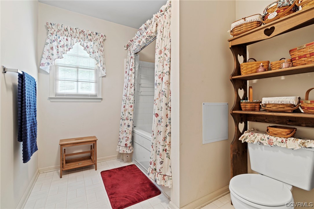 3963 Doe Run Road Hopewell, VA 23860 - Photo 19 of 48 a bathroom with a toilet and a shower curtain