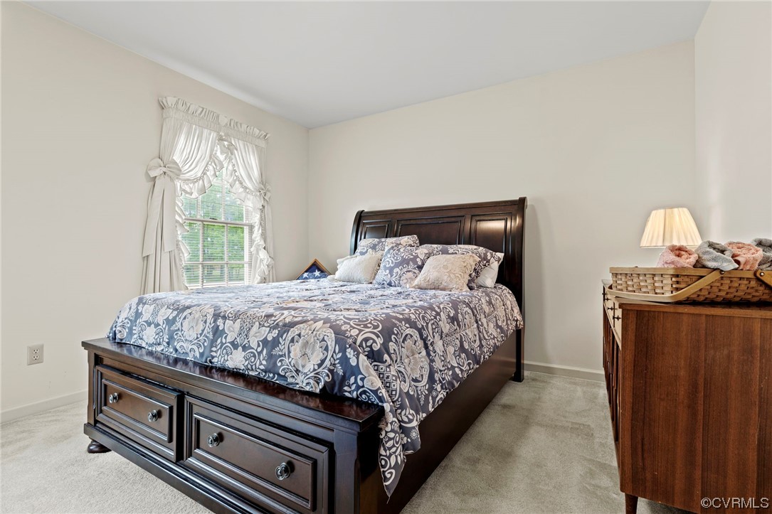 3963 Doe Run Road Hopewell, VA 23860 - Photo 28 of 48 a bed sitting in a bedroom next to a window