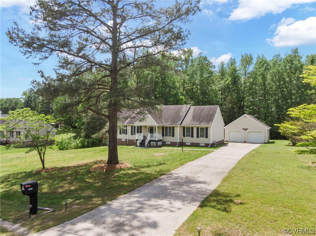 3963 Doe Run Road Hopewell, VA 23860 - Photo 4 of 48 a front view of a house with garden