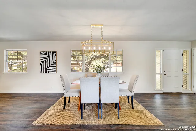 a view of a dining room with furniture window and wooden floor