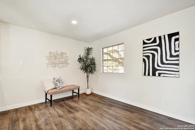 a view of entryway with stairs and wooden floor