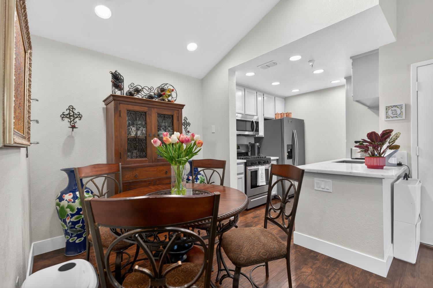 8020 Walerga Road, Unit 1140 Antelope, CA 95843 - Photo 10 of 37 a view of a dining room with furniture and chandelier