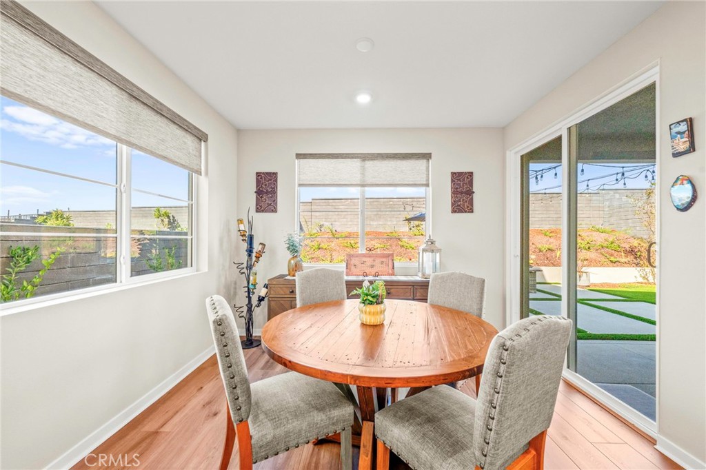 1281 Roots Way Rancho Mission Viejo, CA 92694 - Photo 19 of 75 a view of a dining room with furniture window and outside view