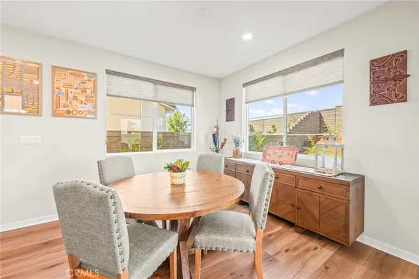a living room with furniture tv and a large window
