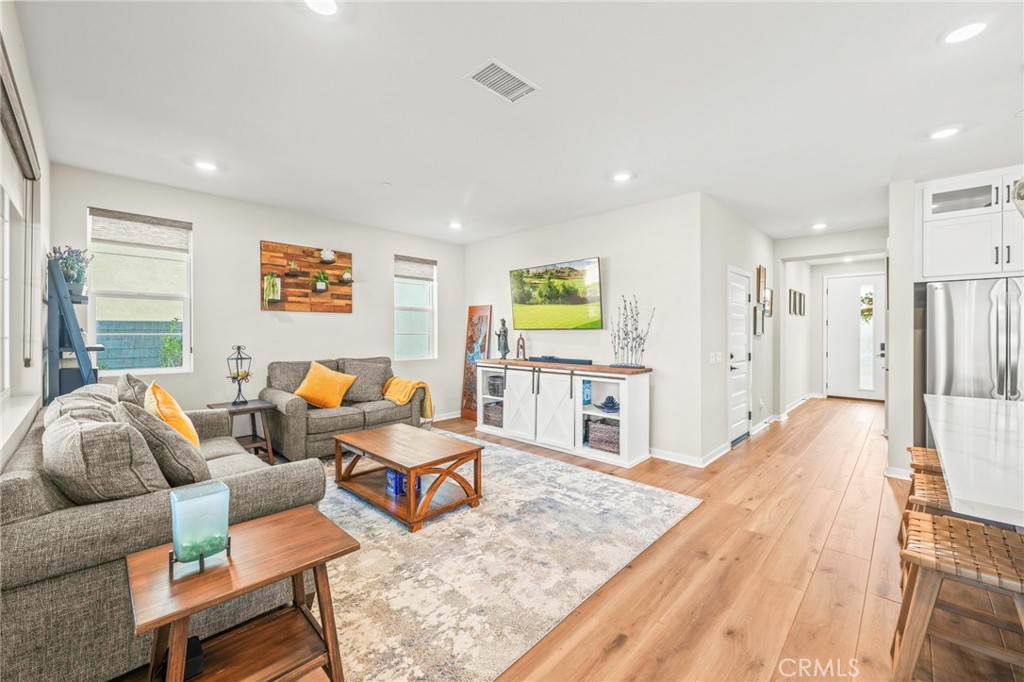 1281 Roots Way Rancho Mission Viejo, CA 92694 - Photo 23 of 75 a living room with furniture and a flat screen tv