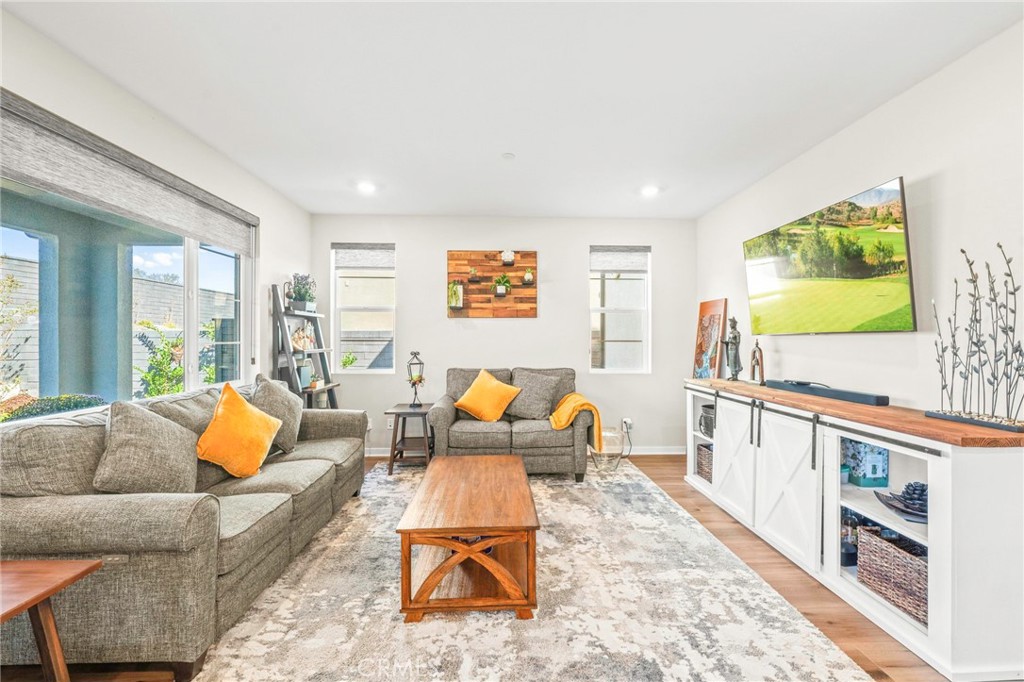 1281 Roots Way Rancho Mission Viejo, CA 92694 - Photo 24 of 75 a living room with furniture and a flat screen tv