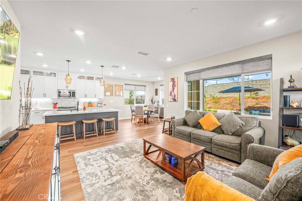 1281 Roots Way Rancho Mission Viejo, CA 92694 - Photo 25 of 75 a living room with furniture and a table