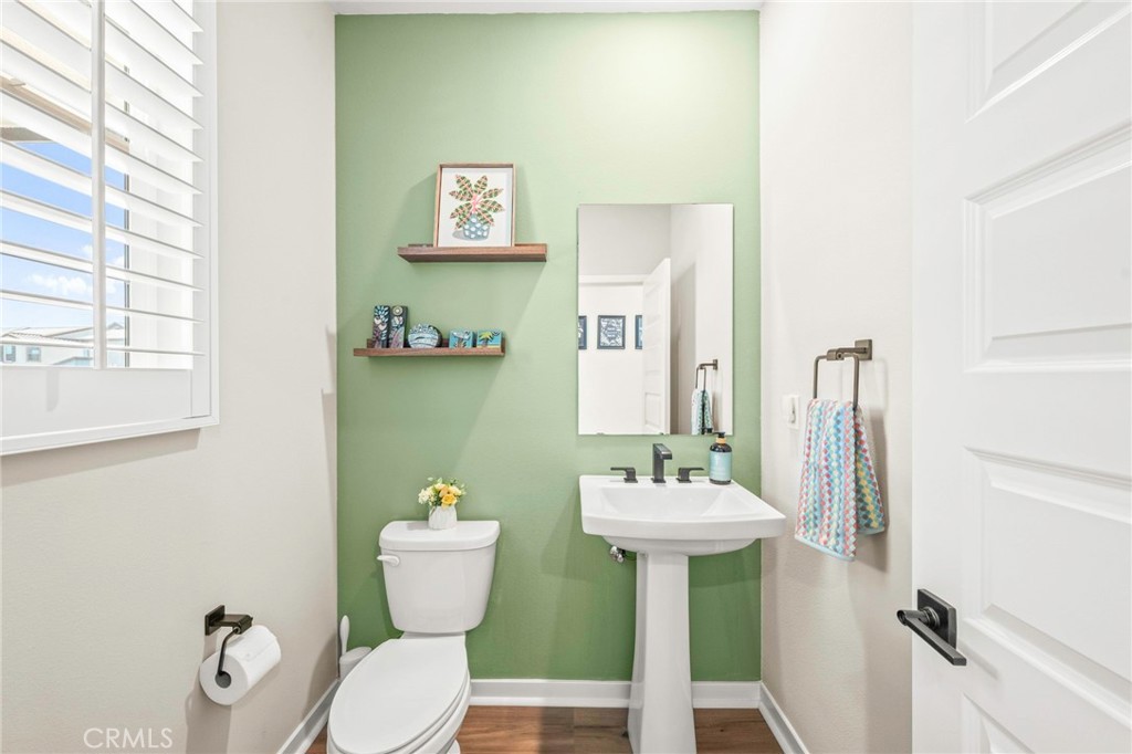 1281 Roots Way Rancho Mission Viejo, CA 92694 - Photo 27 of 75 a bathroom with a sink mirror and toilet