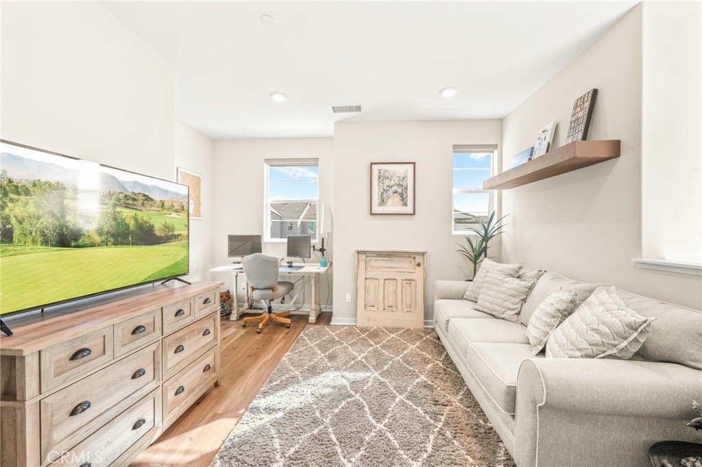 1281 Roots Way Rancho Mission Viejo, CA 92694 - Photo 28 of 75 a living room with furniture tv and a large window