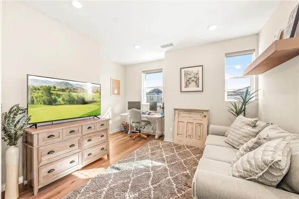 a view of a house with backyard porch and sitting area