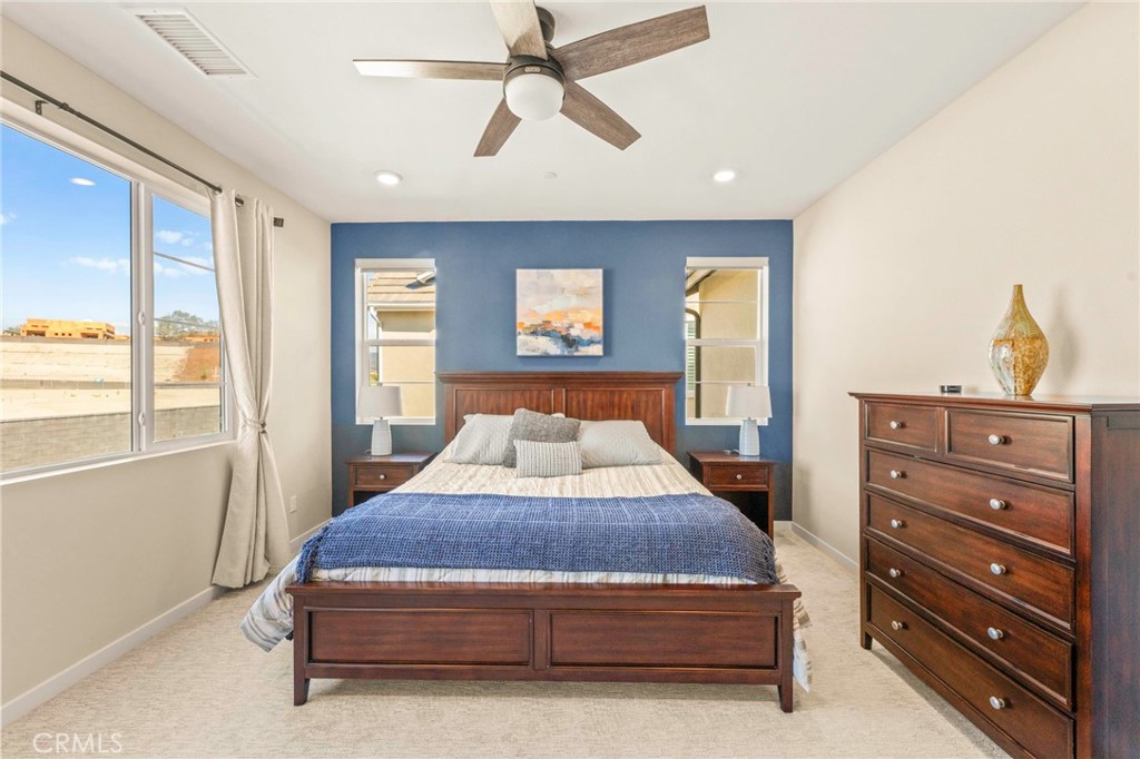 1281 Roots Way Rancho Mission Viejo, CA 92694 - Photo 32 of 75 a bedroom with a bed and large windows