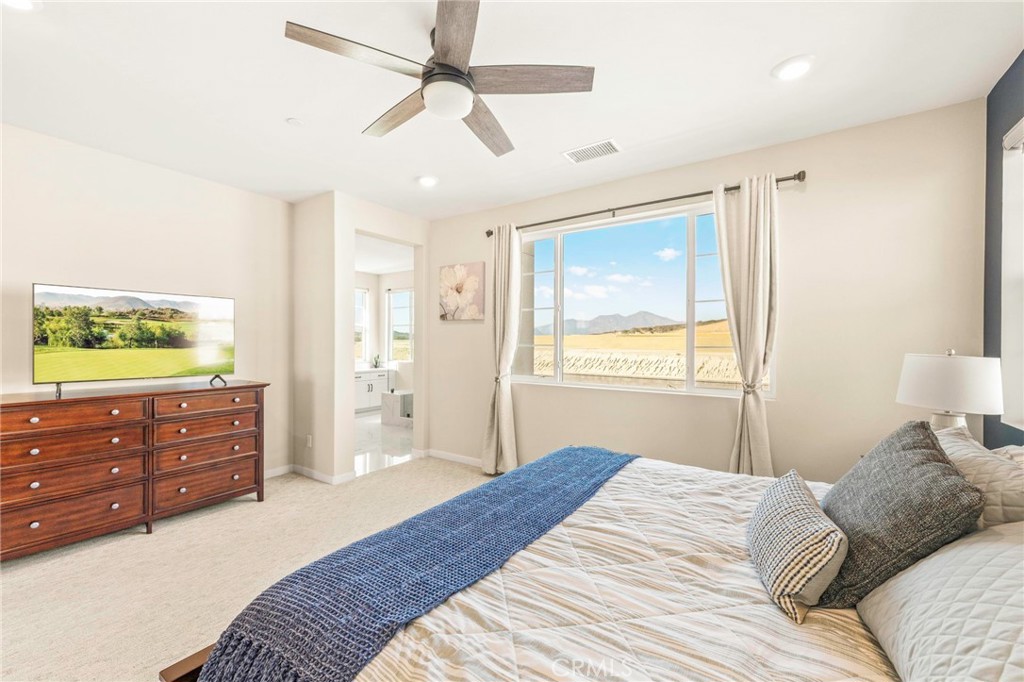 1281 Roots Way Rancho Mission Viejo, CA 92694 - Photo 33 of 75 a bedroom with a bed and a dresser