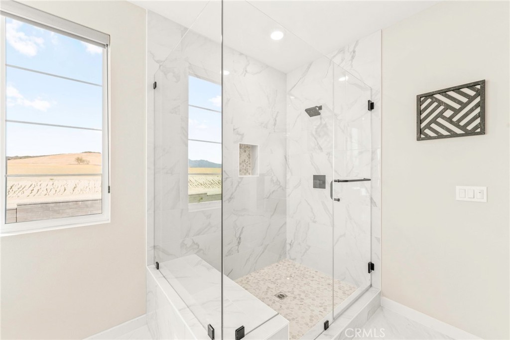 1281 Roots Way Rancho Mission Viejo, CA 92694 - Photo 36 of 75 a bathroom with a shower and a glass door