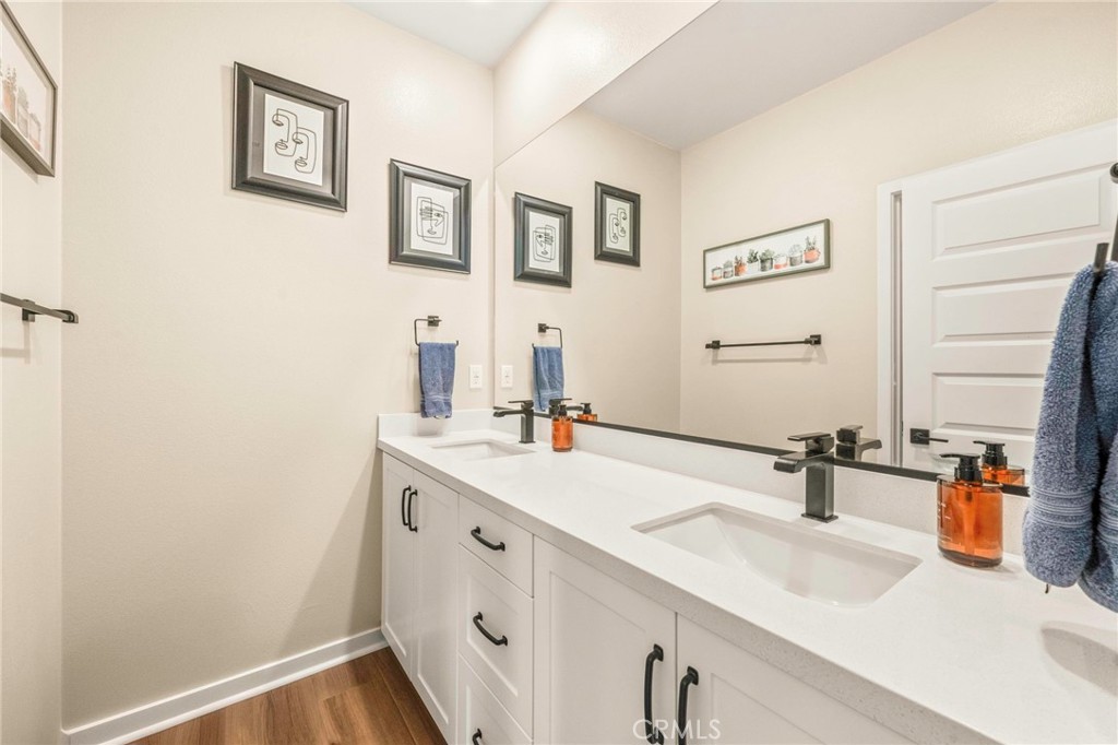 1281 Roots Way Rancho Mission Viejo, CA 92694 - Photo 41 of 75 a bathroom with a sink and a mirror