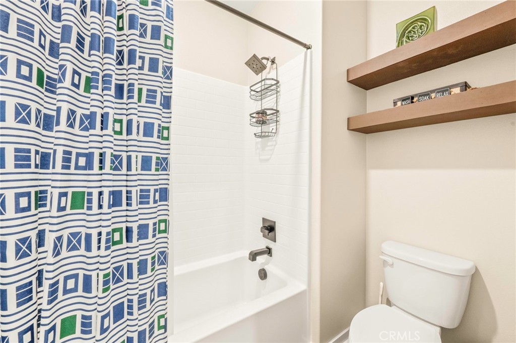 1281 Roots Way Rancho Mission Viejo, CA 92694 - Photo 42 of 75 a bathroom with a bathtub and a shower curtain