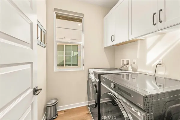 a view of a patio with couches table and chairs and potted plants