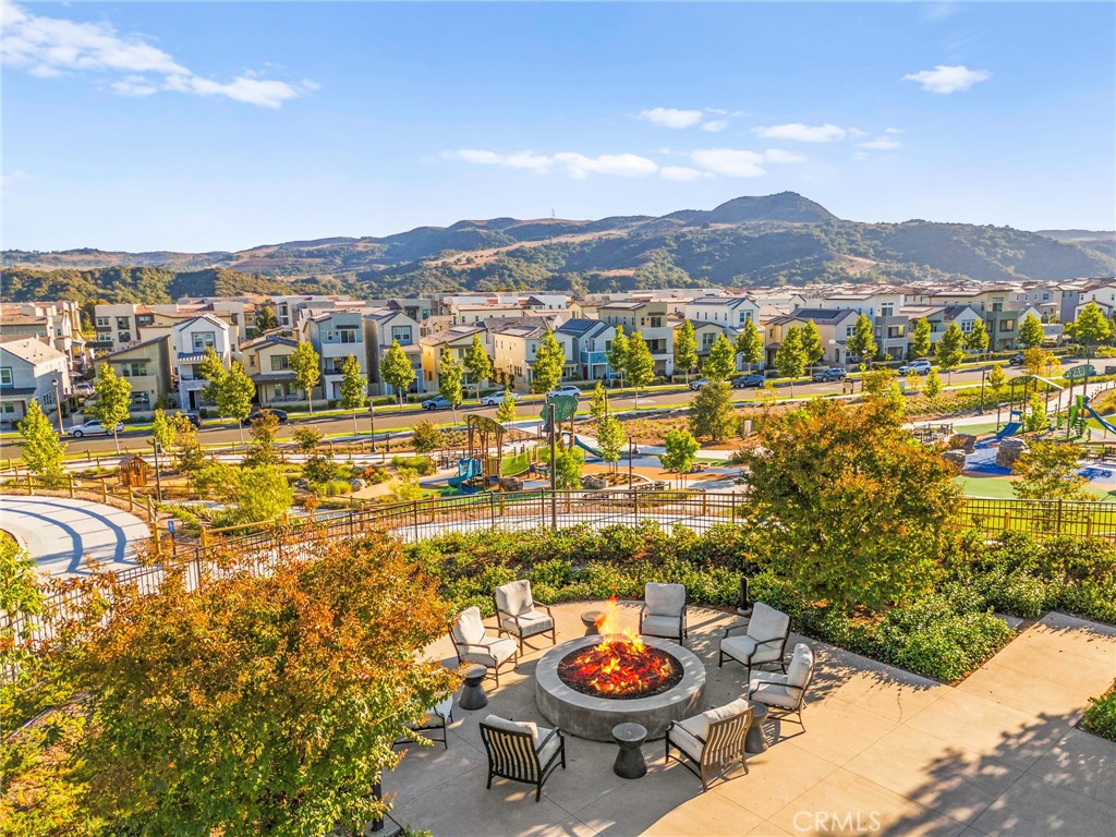 1281 Roots Way Rancho Mission Viejo, CA 92694 - Photo 62 of 75 a view of a balcony with dining table and a chairs
