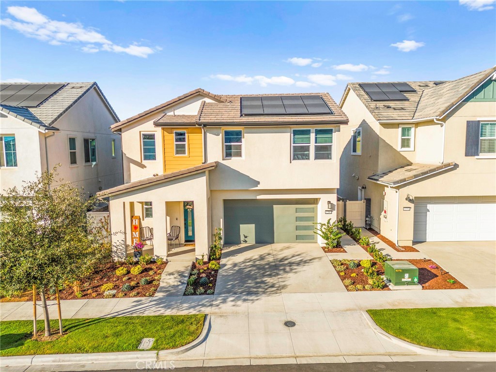 1281 Roots Way Rancho Mission Viejo, CA 92694 - Photo 73 of 75 a view of a white house with a yard and table and chairs