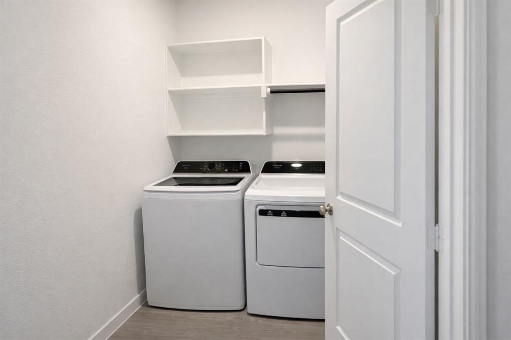 6420 Ponderosa Pne Road McKinney, TX 75071 - Photo 6 of 10 Laundry area featuring light wood-type flooring and washing machine and dryer
