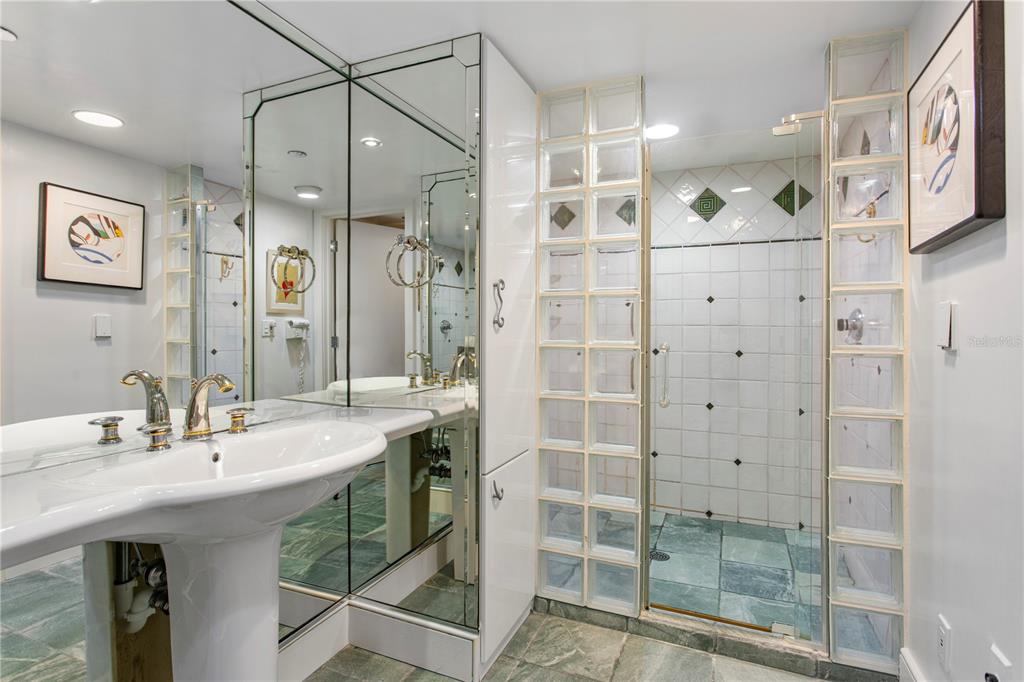 775 Longboat Club Road, Unit 808 Longboat Key, FL 34228 - Photo 22 of 41 a bathroom with a shower sink and mirror