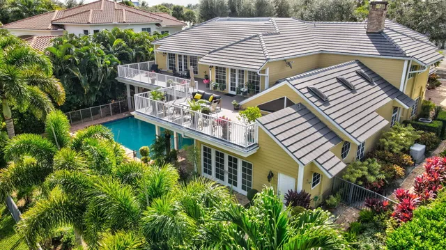 a large kitchen with stainless steel appliances granite countertop a lot of counter space and wooden floors