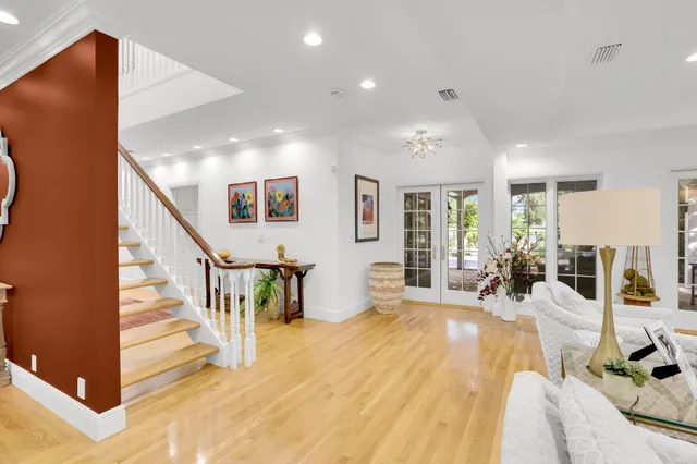 a large bedroom with a large bed and a large window