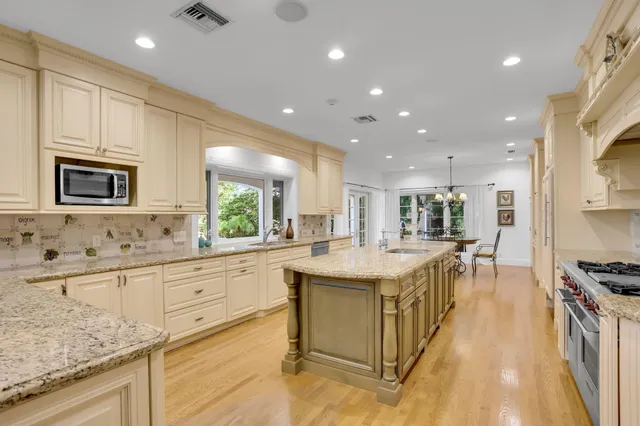 a bedroom with a large bed and a large window