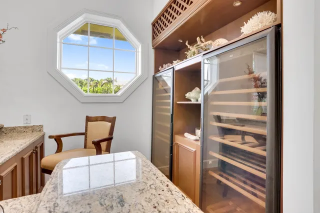 a bathroom with a granite countertop sink a toilet and a shower
