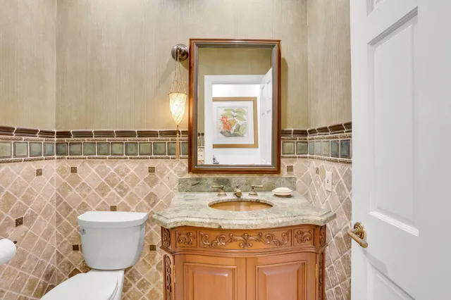 an aerial view of a house with a garden and swimming pool