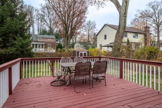 a view of a deck with chairs wooden floor and fence