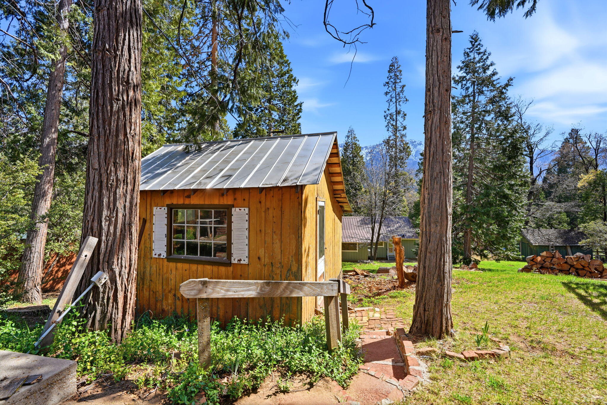 697 Loop Drive Springville, CA 93265 - Photo 42 of 55 a view of a house with backyard and trees