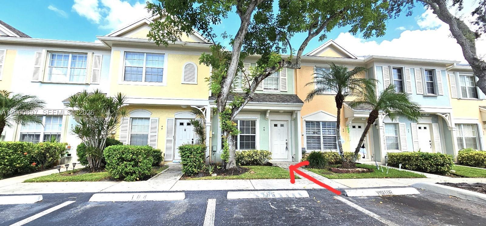 46 Simonton Circle Weston, FL 33326 - Photo 1 of 14 front view of a house with a yard
